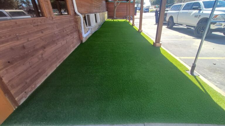 A fake grass on the porch.