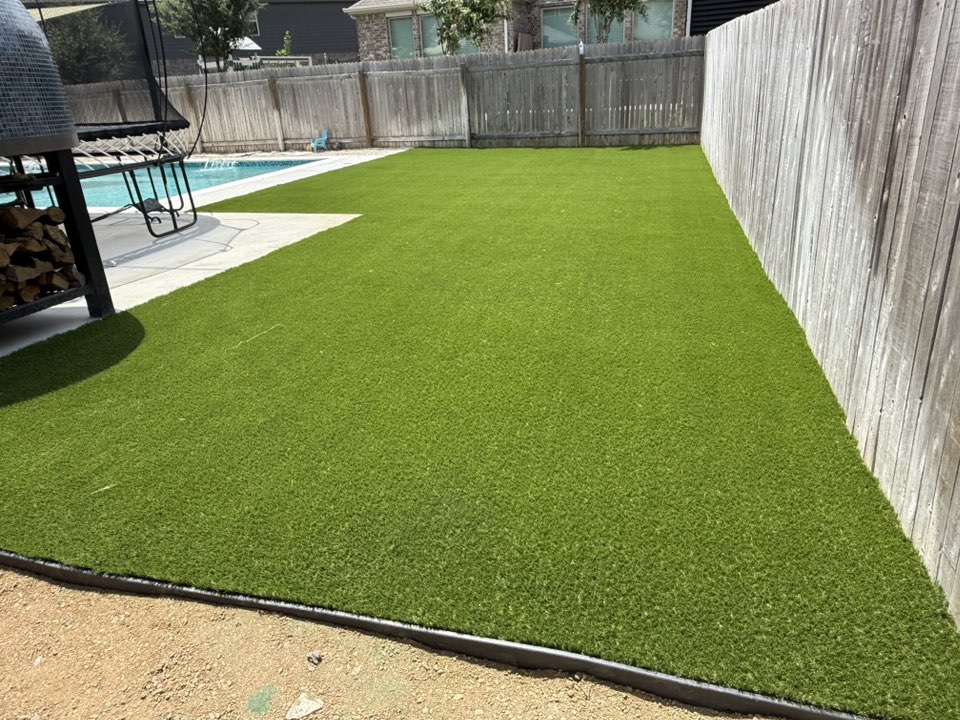 A newly installed fake grass on the backyard.